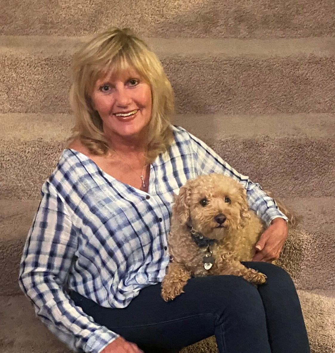 Patty Millin, founder and office manager of Spokane’s Best Pet Sitter, with Howie